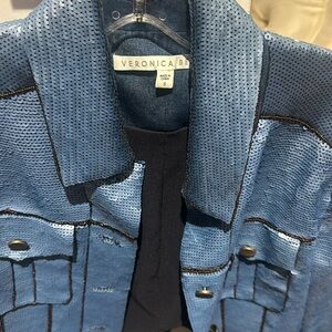 Woman’s jacket looks great with white t- shirt and blue jeans